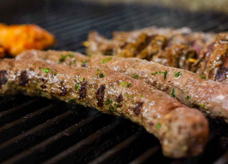 Charbroiled kafta kebab on the grill